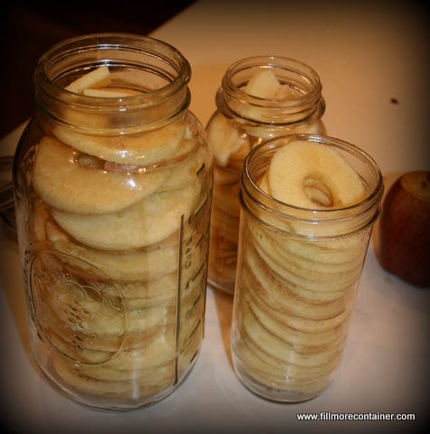 Sliced apples in jars